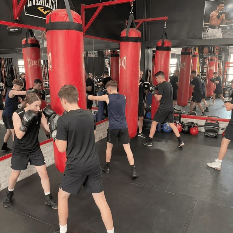 Teens training on the bags at Box2Fit